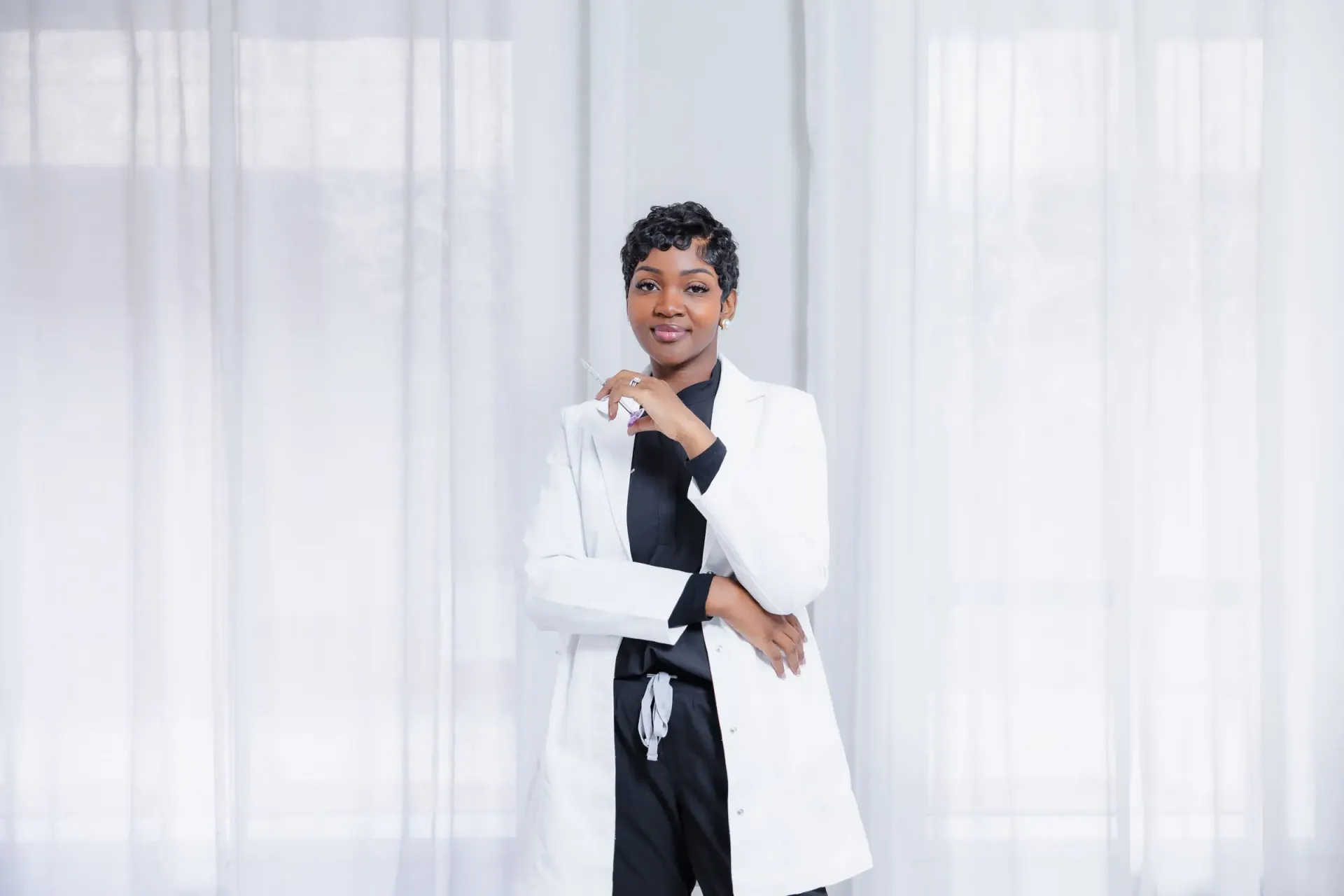 Cleo R. standing confidently in her white coat
