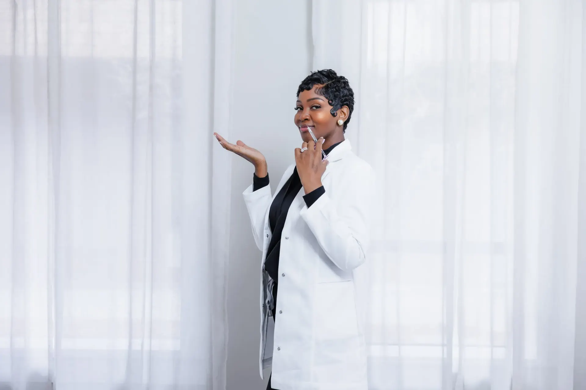 Cleo R. in her white coat holding an aesthetic syringe